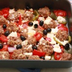 Lamb meatballs with roast vegetables, olives and feta