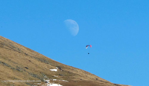 Paragliding in the moon-and-sun-light